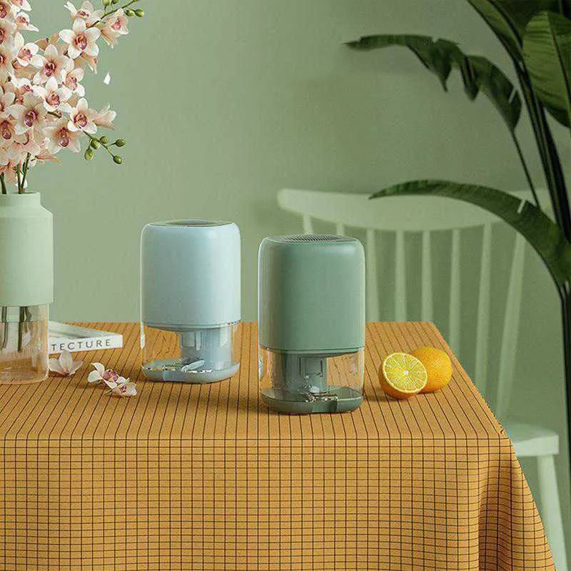 Portable dehumidifier in blue, green, or white with a 0.7 litre water tank.