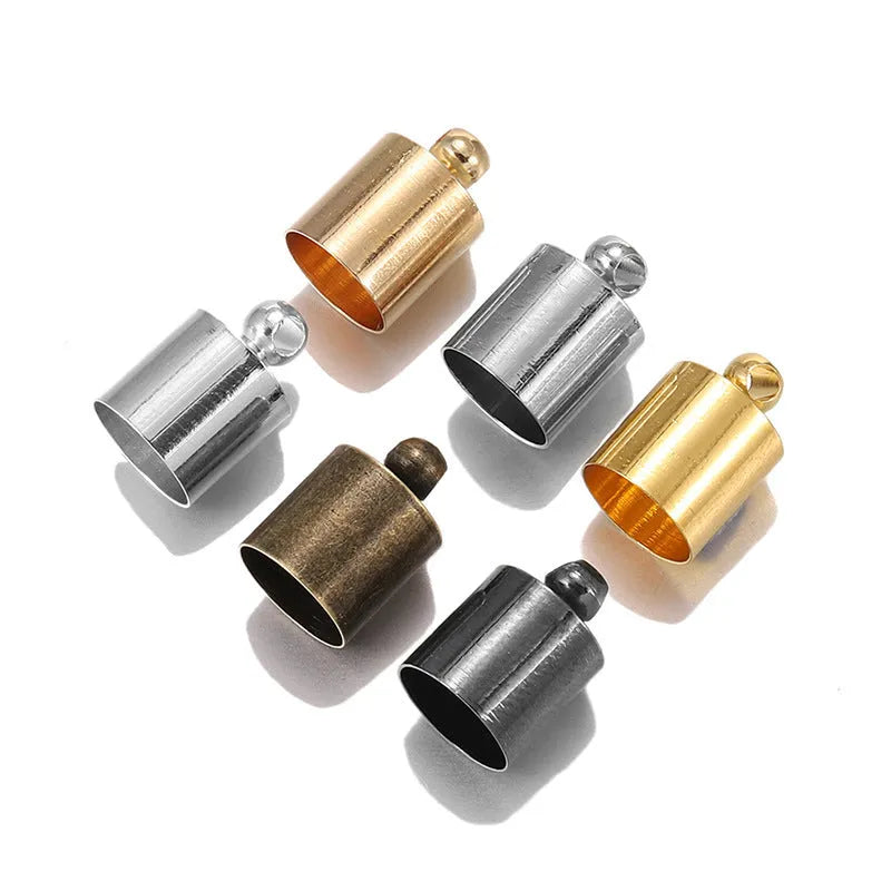 Assortment of multi-colour copper caps in gold, silver, black, and bronze finishes for jewellery making.