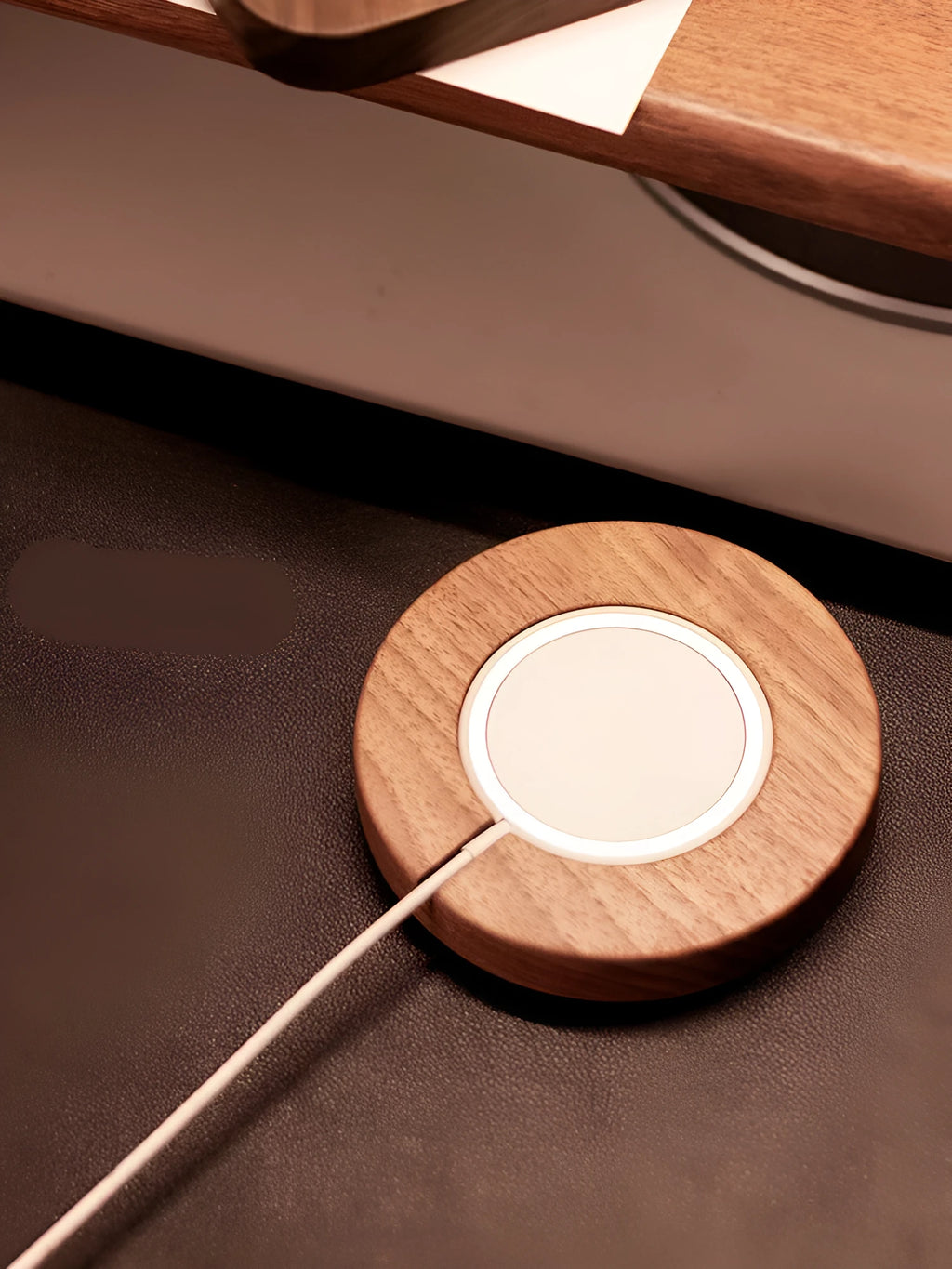 Walnut wood magnetic wireless charger for iPhone with MagSafe compatibility on desk