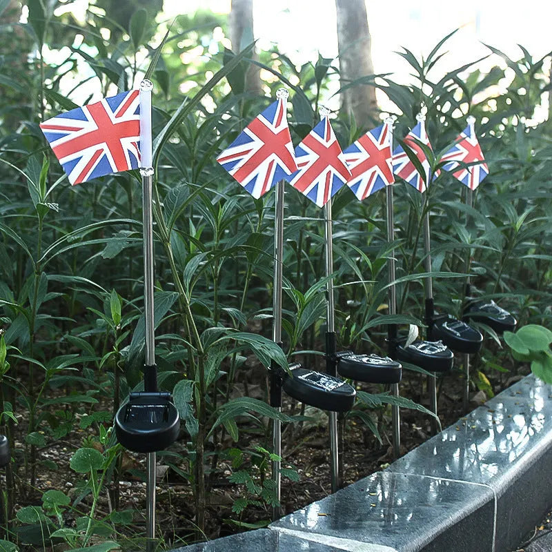 Solar garden flag light with stainless steel pole showing American flag design illuminated by LED