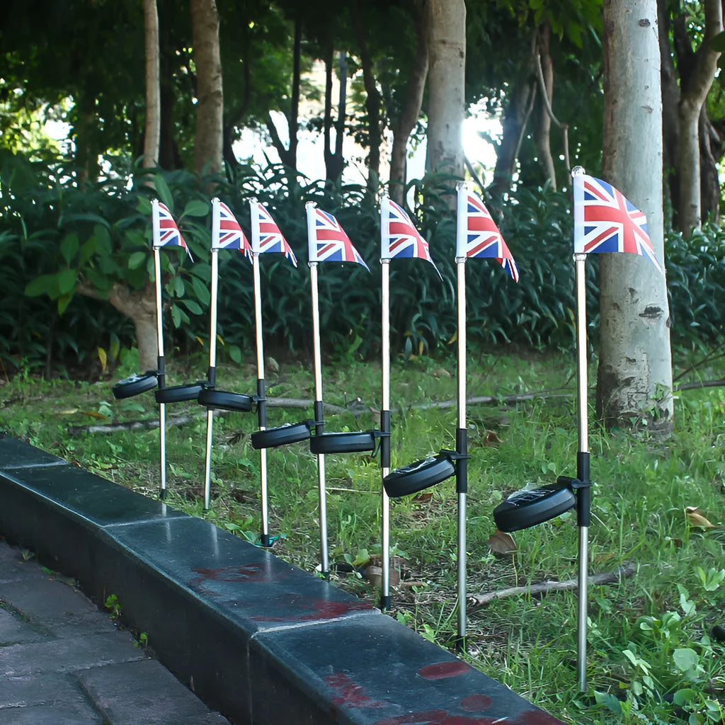 Solar garden flag light with stainless steel pole showing American flag design illuminated by LED