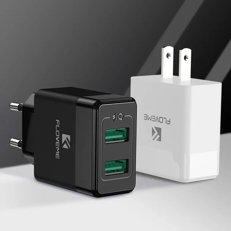 Black and white travel charger with US and European plugs showing USB port for 5V 2.1A mobile phone charging