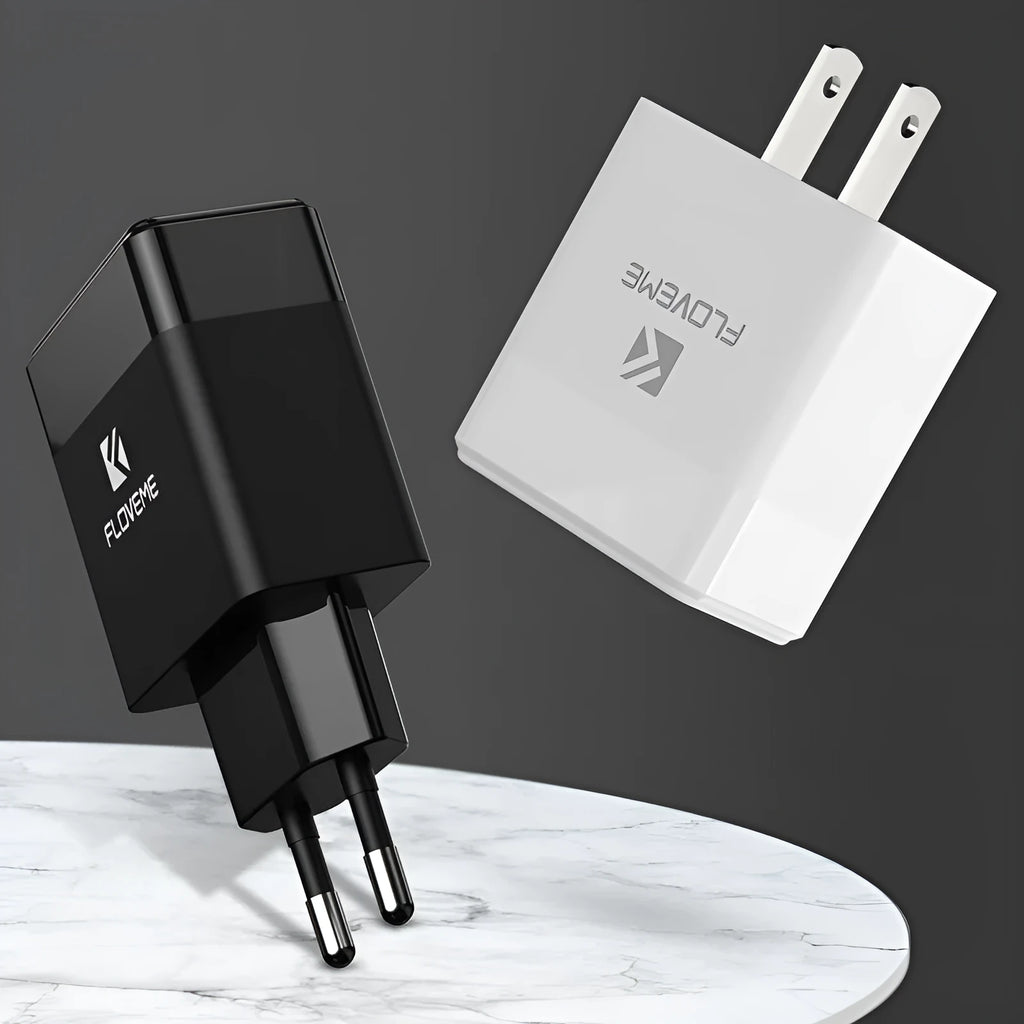 Black and white travel charger with US and European plugs showing USB port for 5V 2.1A mobile phone charging