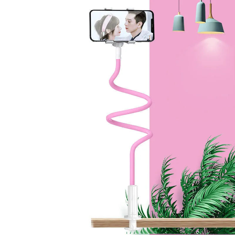 Blue mobile phone and tablet holder with flexible memory alloy hose positioned on a bedside table.