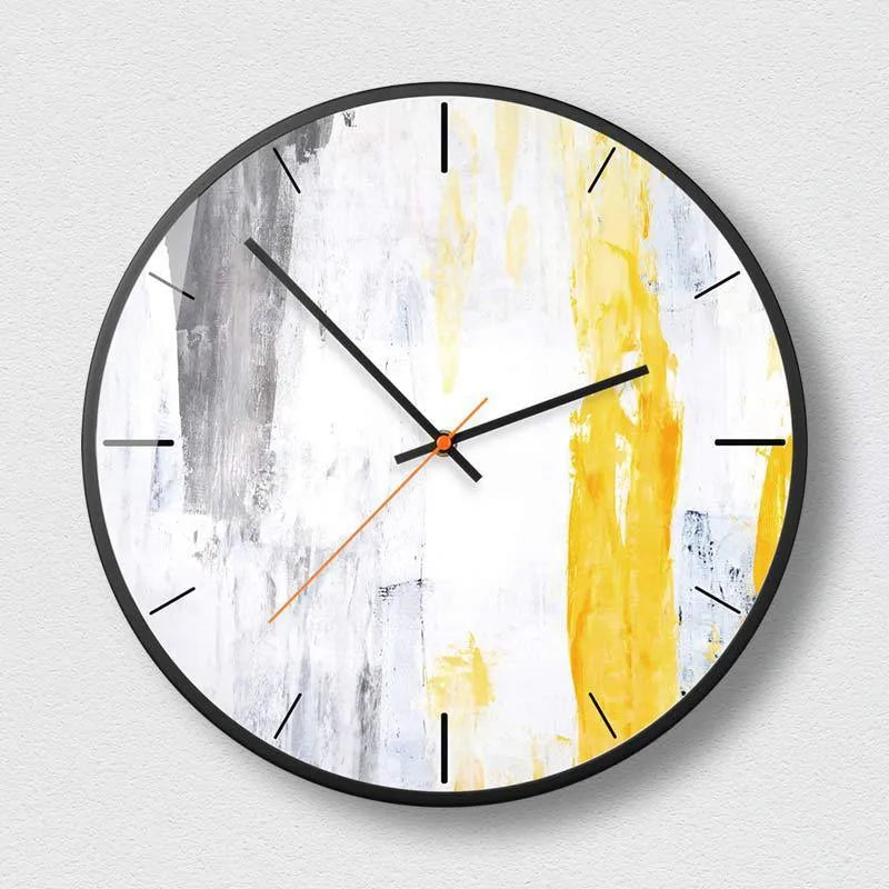 Round abstract art wall clock with metal case in black on a wall