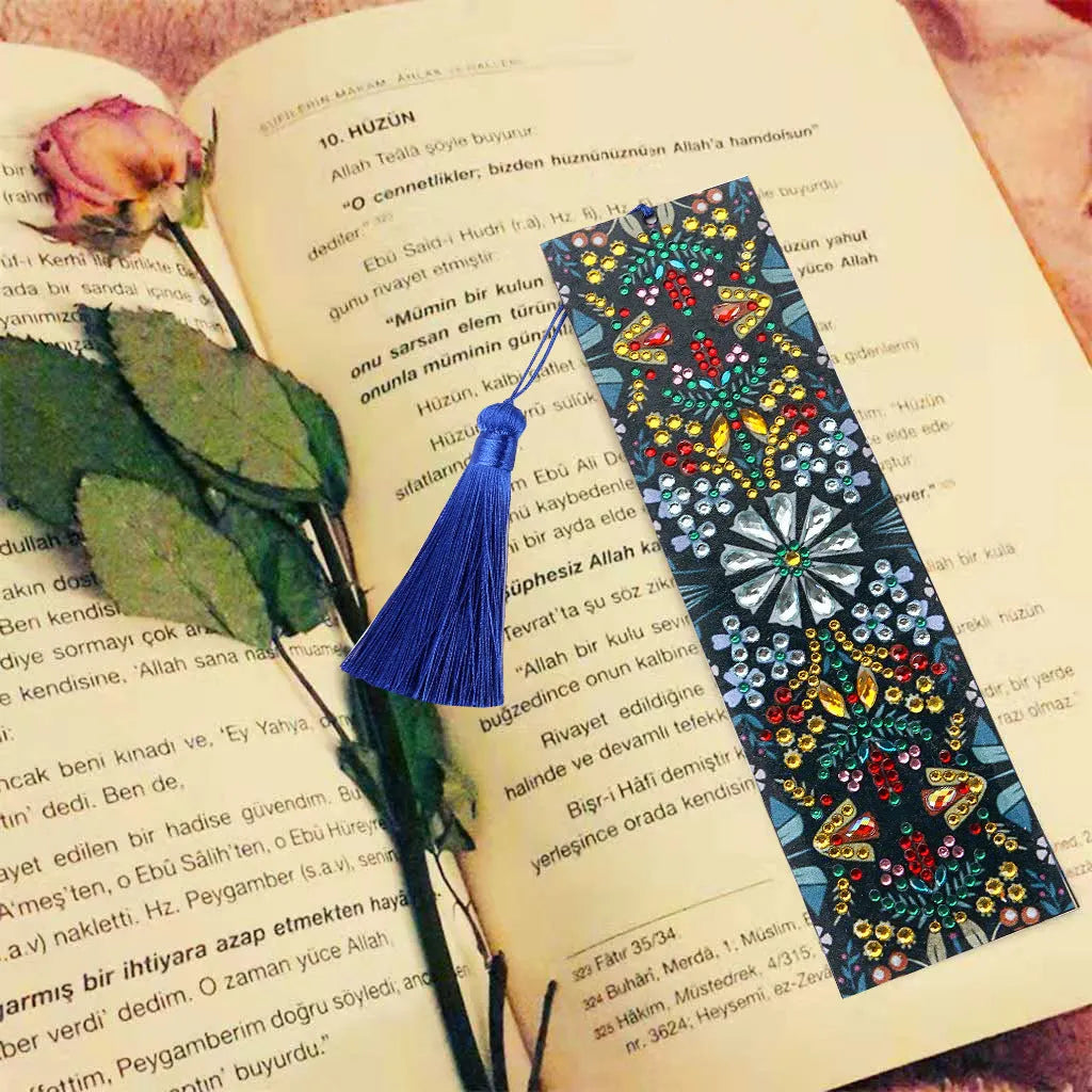 Handcrafted leather bookmark with diamond mandala flower embroidery.