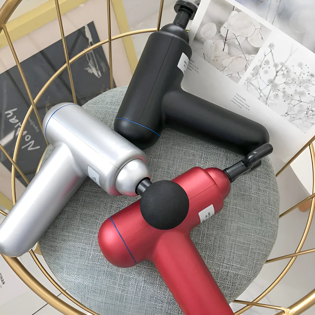 God fascia gun muscle massager in black, red, or grey colour with USB cable for power.