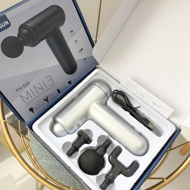 God fascia gun muscle massager in black, red, or grey colour with USB cable for power.