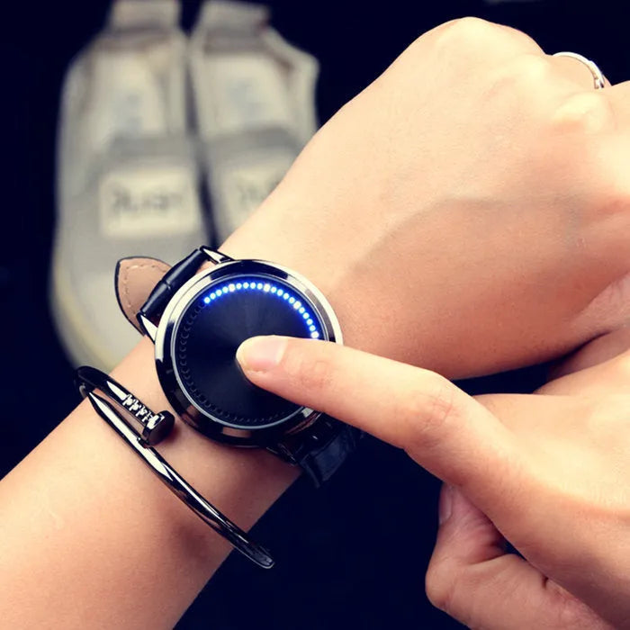 Electronic digital watch with blue LED light display showing numbers, available in black and white colours