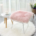 Plush office chair butt pad 30x30cm polyester fibre filling in white on a desk chair