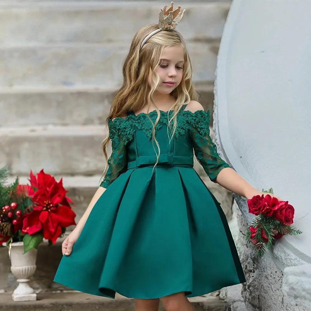 Simple lace-trimmed girls dress in polyester fibre, shown in dark red, green, pink, red or white.