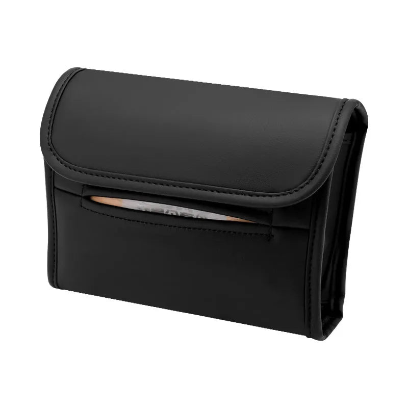 Brown leather car tissue box with elastic band hanging from a car sun visor