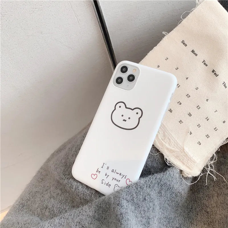 Silicone iPhone back cover case featuring a cartoon Korean bear design, shown on a mobile phone.