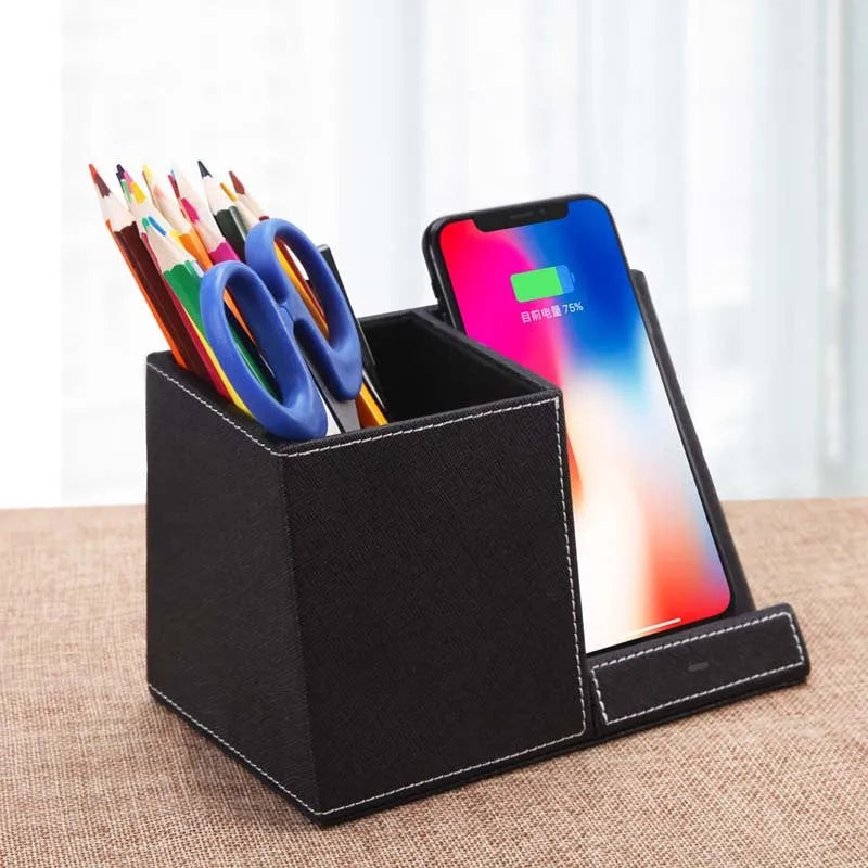 Black leather desk organiser with wireless phone charging surface and pen holder compartment