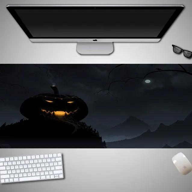 Oversized Halloween-themed mouse pad with non-slip rubber cloth base on a desk