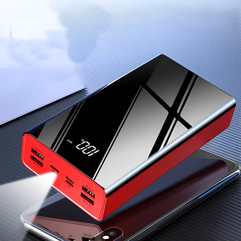 Large black and red 40000mAh power bank with LCD digital display showing battery percentage.