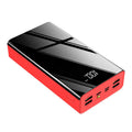 Large black and red 40000mAh power bank with LCD digital display showing battery percentage.