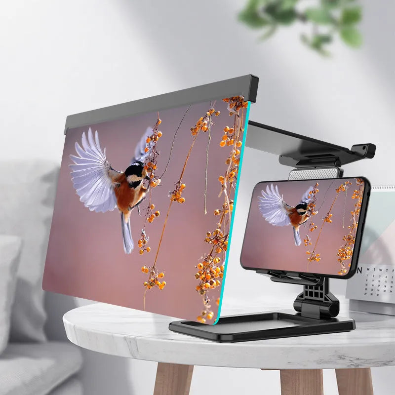 Black mobile phone screen amplifier with detachable phone holder on desktop surface