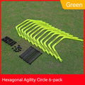 Six foldable hexagon agility training rings in green, orange, and yellow colours laid out on grass.