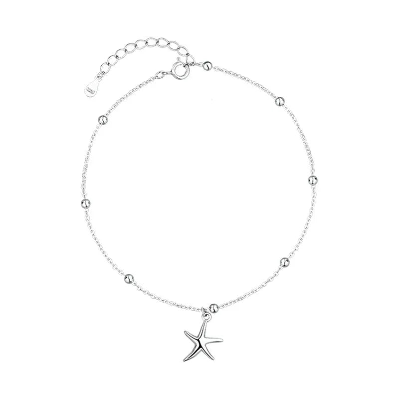 Close-up of a women's S925 sterling silver anklet with a starfish charm and round beads on an adjustable chain.
