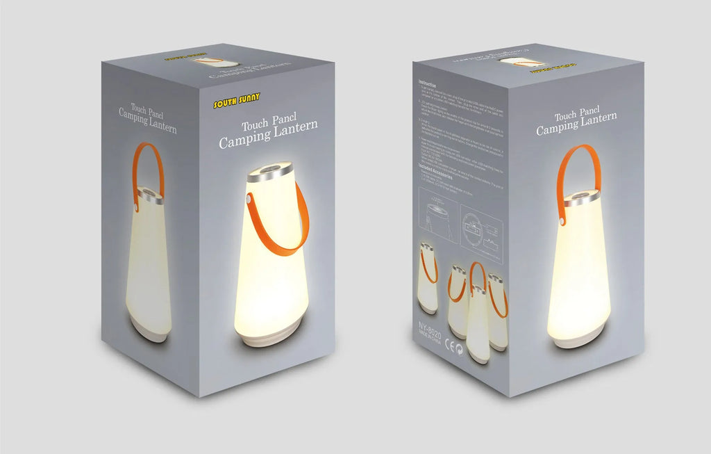 White rechargeable LED lantern night light with USB cable on a table