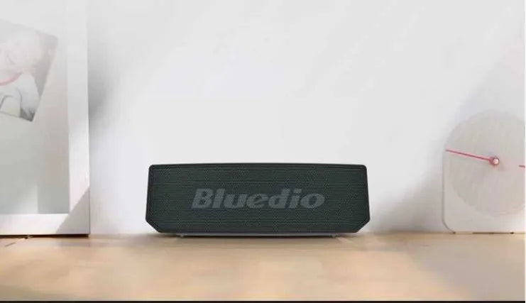 BS-6 black cloud smart speaker showing compact dimensions and speaker grille