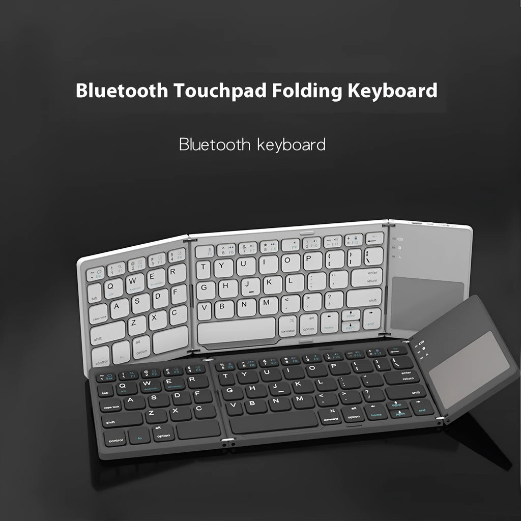 Black tri-fold portable Bluetooth keyboard shown open next to a smartphone, demonstrating its compact size.