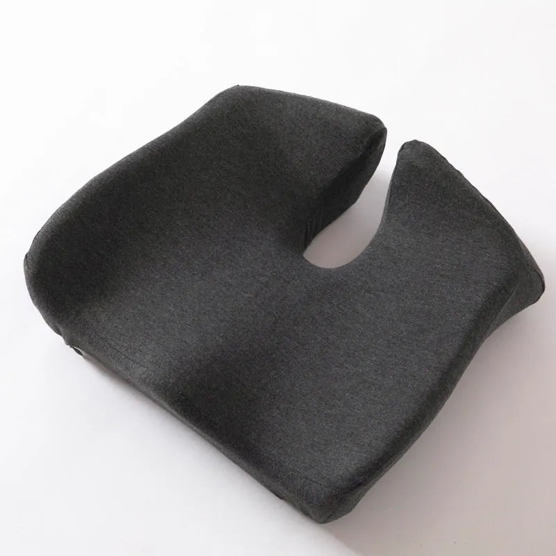 Memory foam office chair cushion with waist support in grey colour on wooden chair