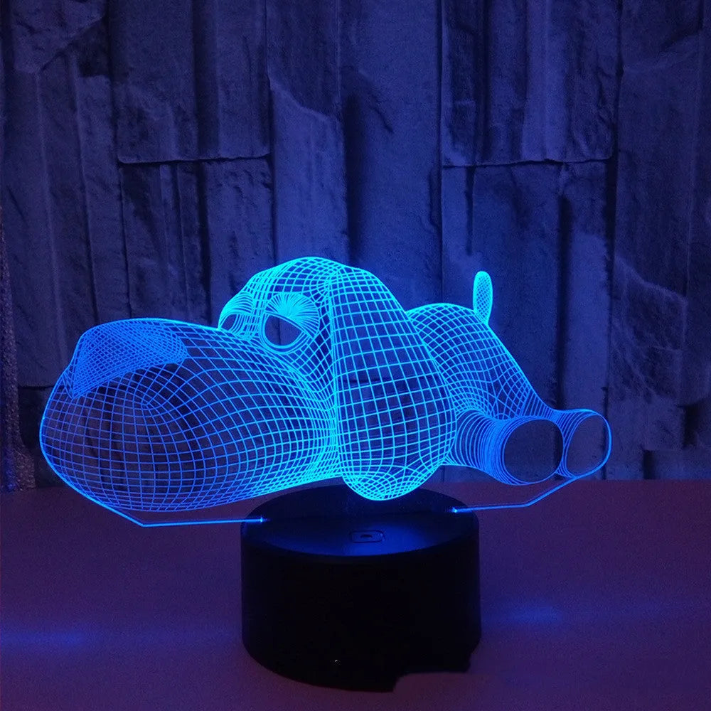 Doggo Desktop Lamp showing 3D dog illusion glowing in blue light on a desk