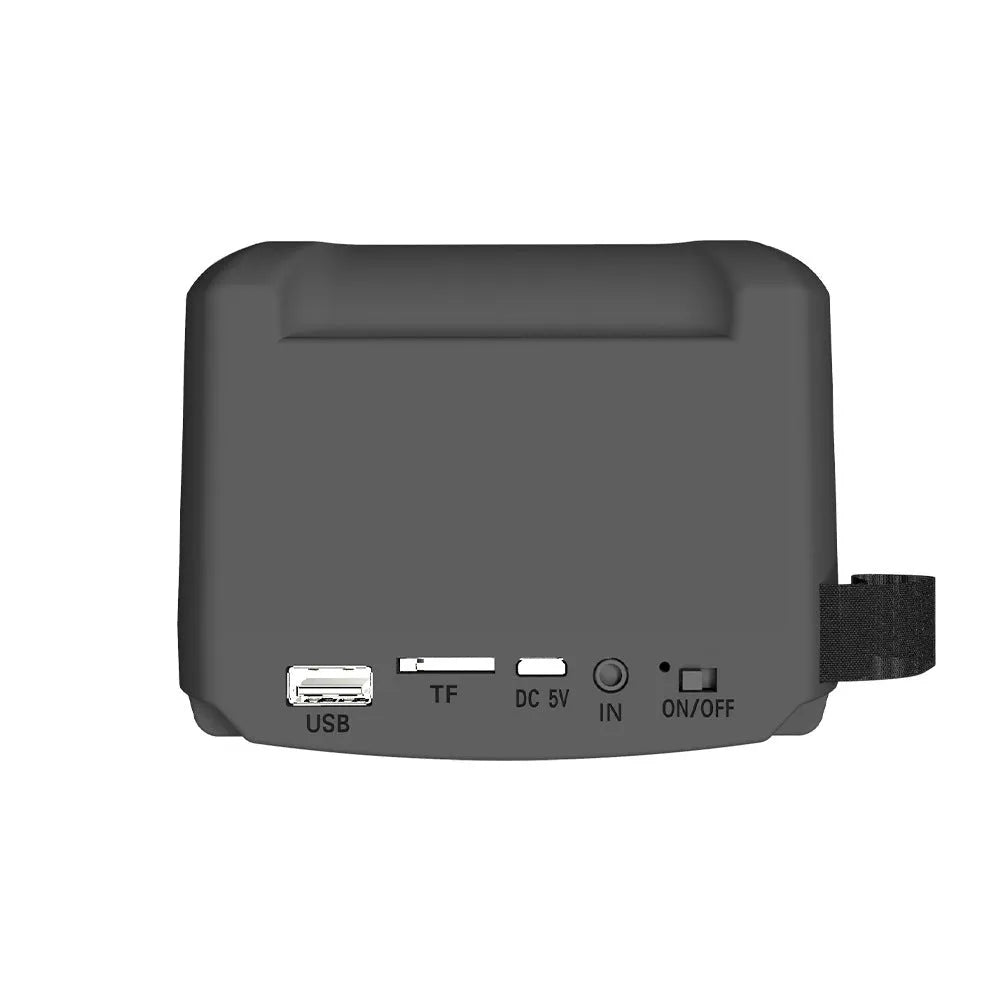 Small portable Bluetooth speaker in colour 3107 with USB charging cable on a desk