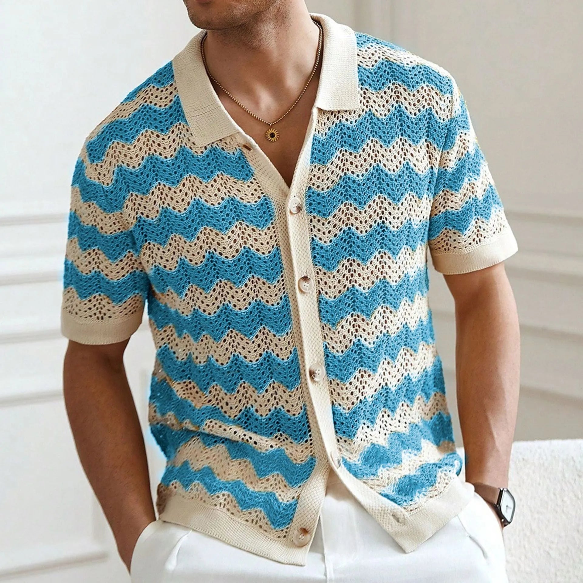 Yellow short-sleeve corduroy sweater with flocked jacquard pattern on a hanger.