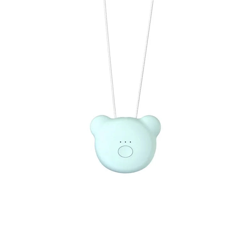 Mini USB air purifier pendant on a necklace, shown in pink colour with charging cable.