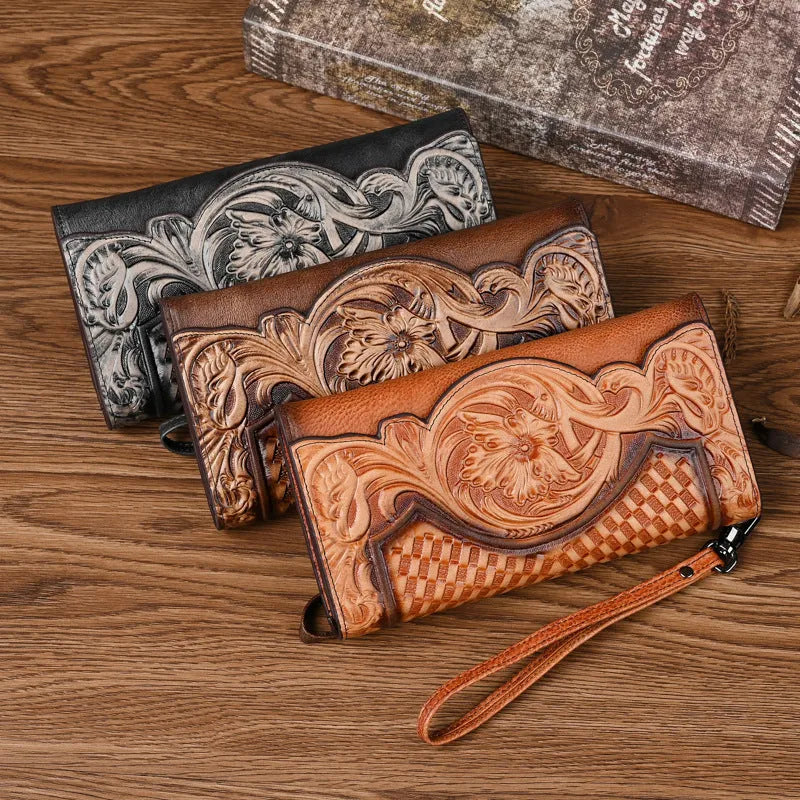 Women's brown embossed floral pattern tri-fold leather wallet showing open compartments