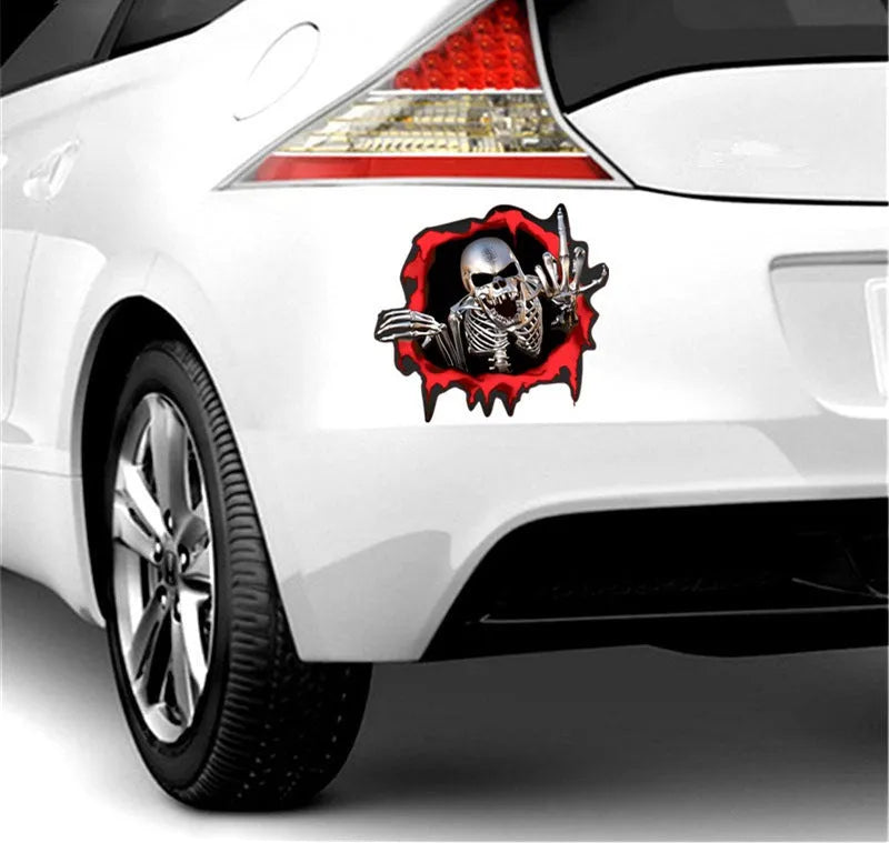 Printed reflective colourful broken shell and metal skull design car sticker measuring 15cm by 14cm.