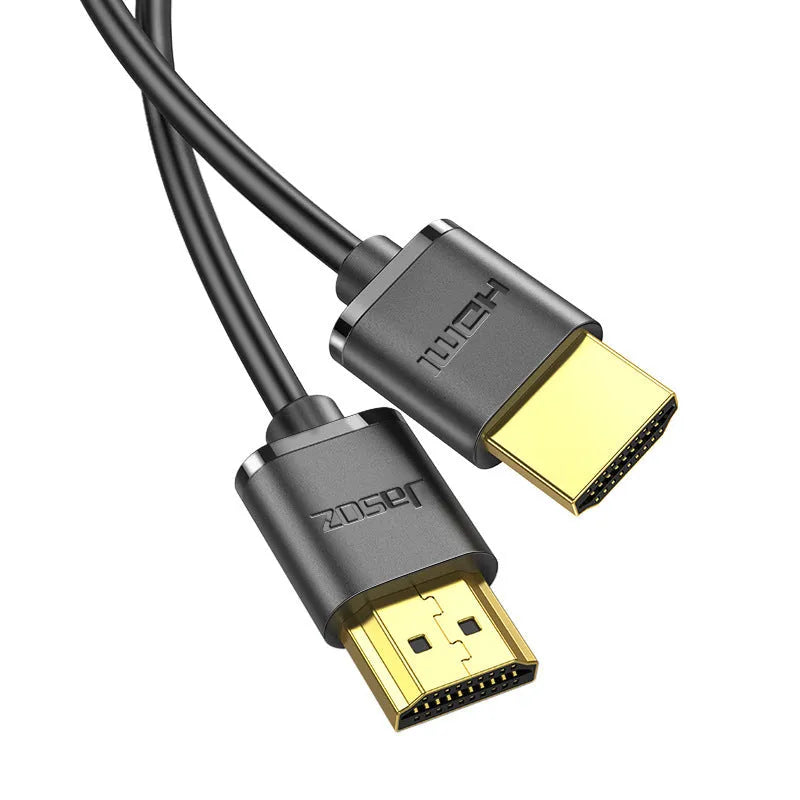 A thin, flexible black HDMI cable with gold-plated connectors on a white background.