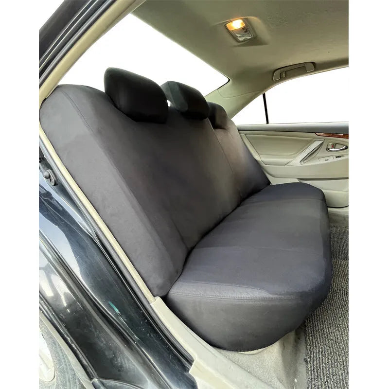 Polyester car seat cover set with eyelet stitching in blue, showing headrest and seat covers with sponge padding.