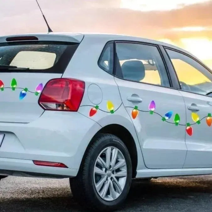 Set of magnetic reflective Christmas light bulb and wire stickers on a car door.