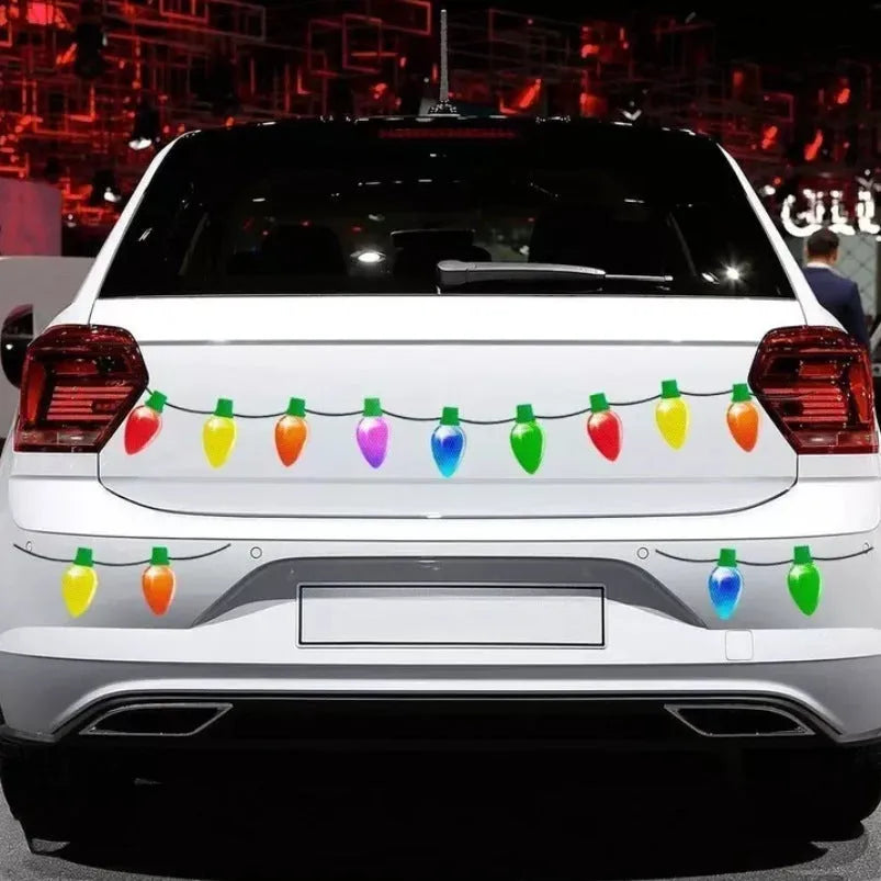 Set of magnetic reflective Christmas light bulb and wire stickers on a car door.