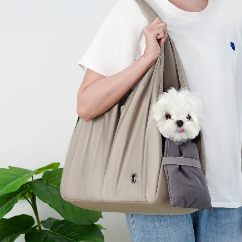 Apricot-colour cloth pet carrier handbag for small pets, showing single handle and rectangular shape.