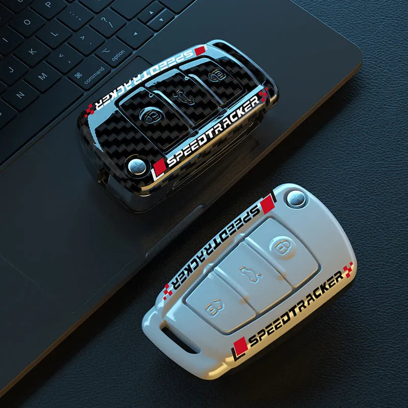 Carbon fibre pattern car key cover in black and white options with minimalist design
