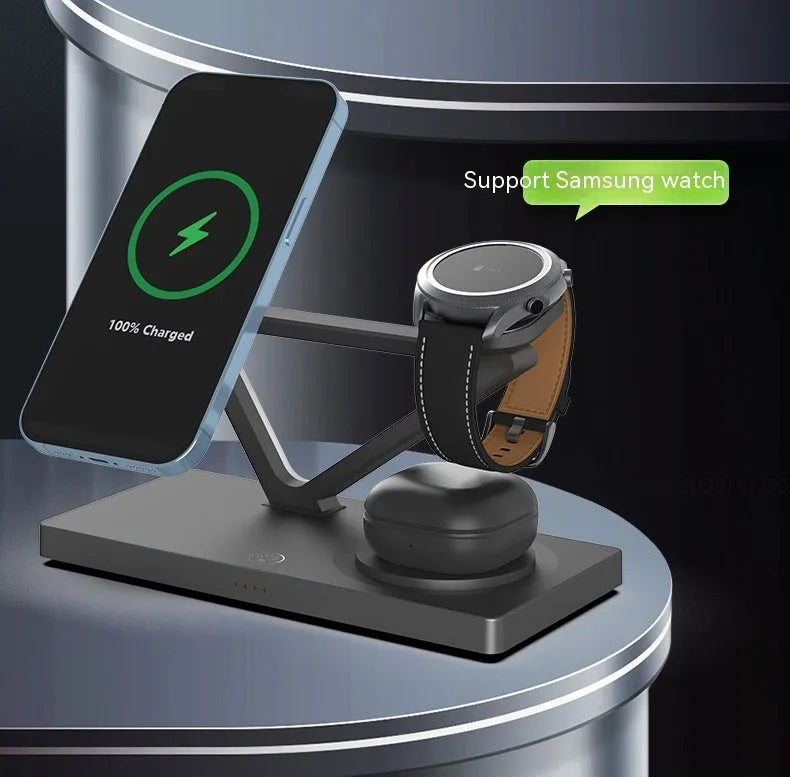 Black and white five-in-one wireless charging station with magnetic phone bracket, watch charger, and night light on wooden surface