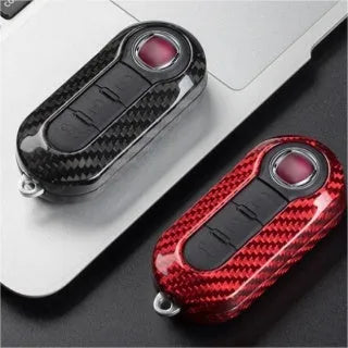 Carbon fibre and glass fibre car key replacement shell set showing black, red, and silver black colour options
