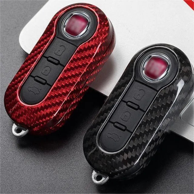 Carbon fibre and glass fibre car key replacement shell set showing black, red, and silver black colour options