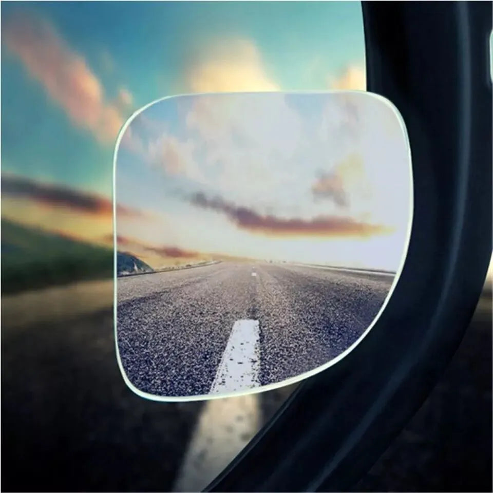 White fan-shaped car blind spot mirror with 360-degree adjustment on universal mounting bracket