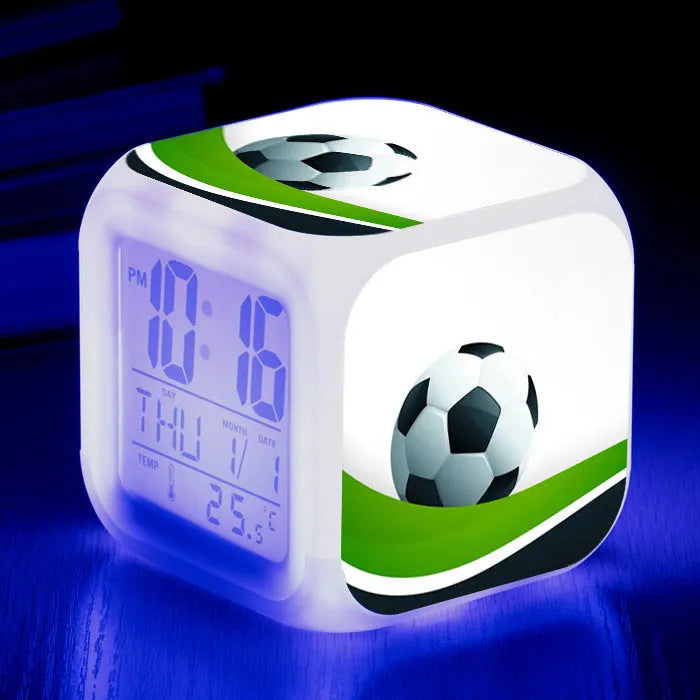Cartoon football pattern silent alarm clock for children on a desk.