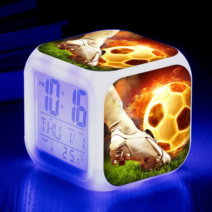 Cartoon football pattern silent alarm clock for children on a desk.