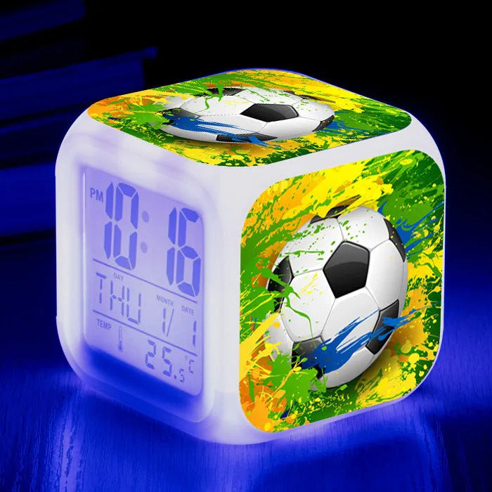 Cartoon football pattern silent alarm clock for children on a desk.