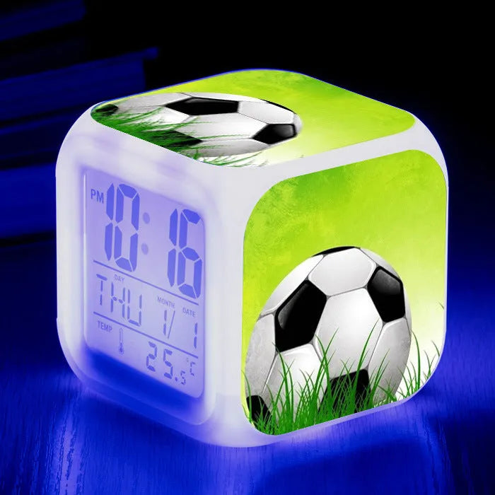 Cartoon football pattern silent alarm clock for children on a desk.