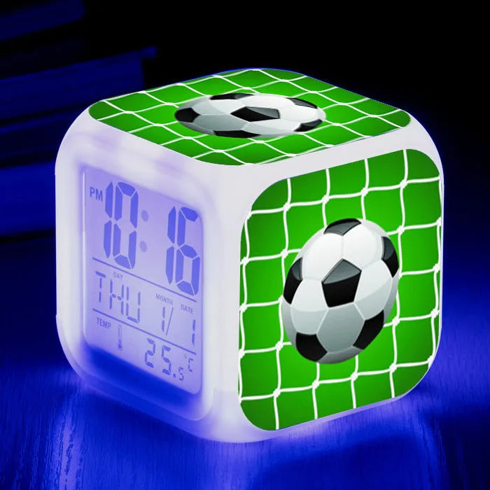 Cartoon football pattern silent alarm clock for children on a desk.