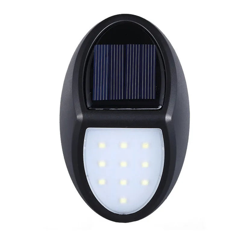 Compact black rectangular solar-powered LED wall light mounted on an outdoor wall.